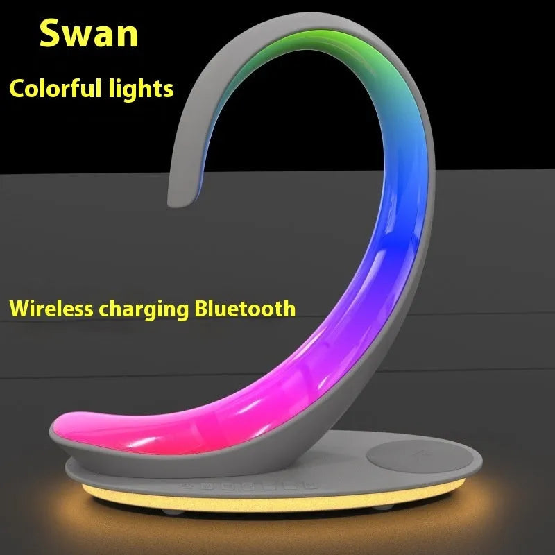 White swan sculpture desktop wireless charger with Bluetooth speaker and colourful LED atmosphere lighting