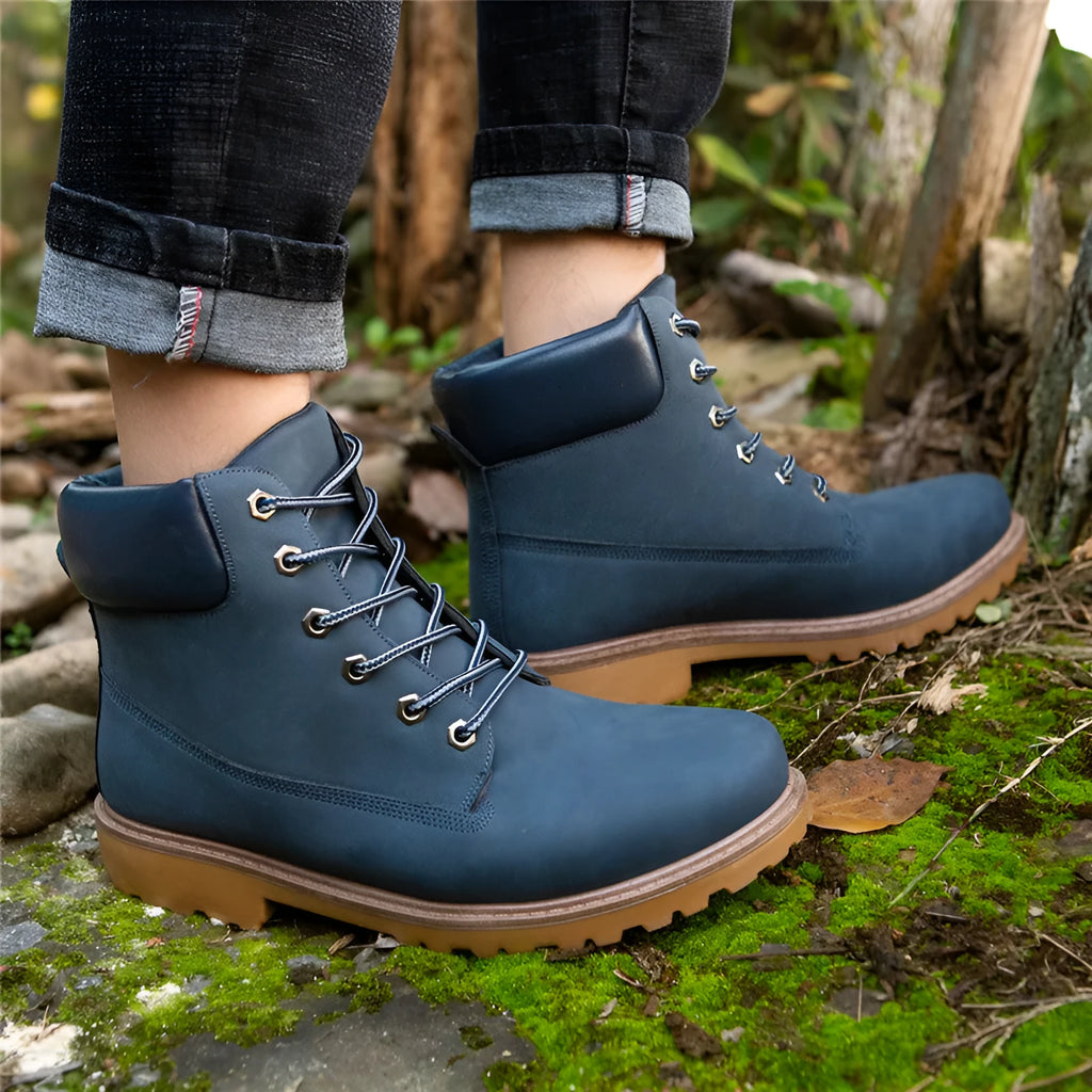 Pink high-top Martin boots with velvet lining, round toe, and front lace-up closure on a flat sole.