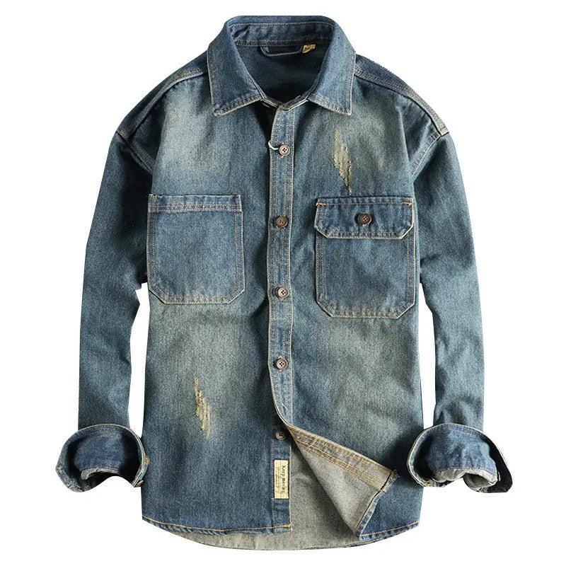 Man wearing a light blue loose-fit vintage denim shirt with long sleeves, cardigan style.