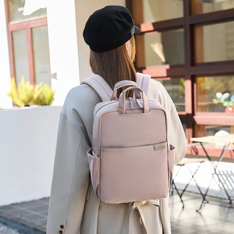 Women's nylon backpack in apricot colour with laptop compartment and organisational pockets