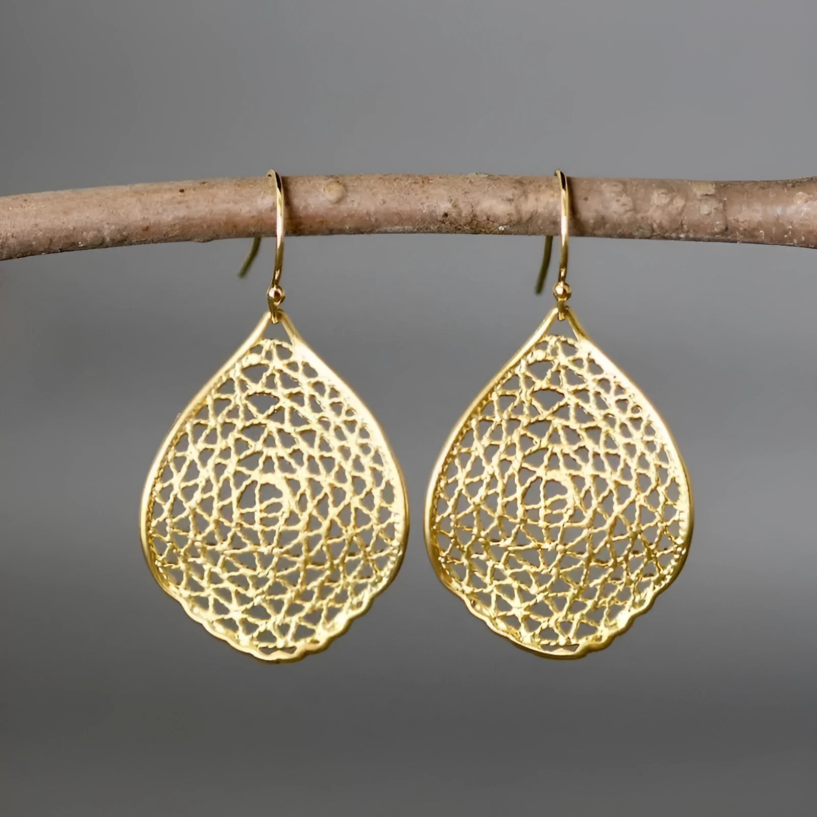 Gold retro leaf hollow pendant drop earrings with vintage design and intricate metalwork