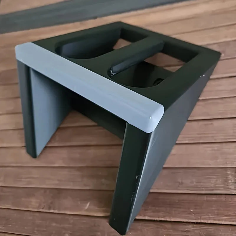 Black plastic punk-style pistol display stand for collectible models.