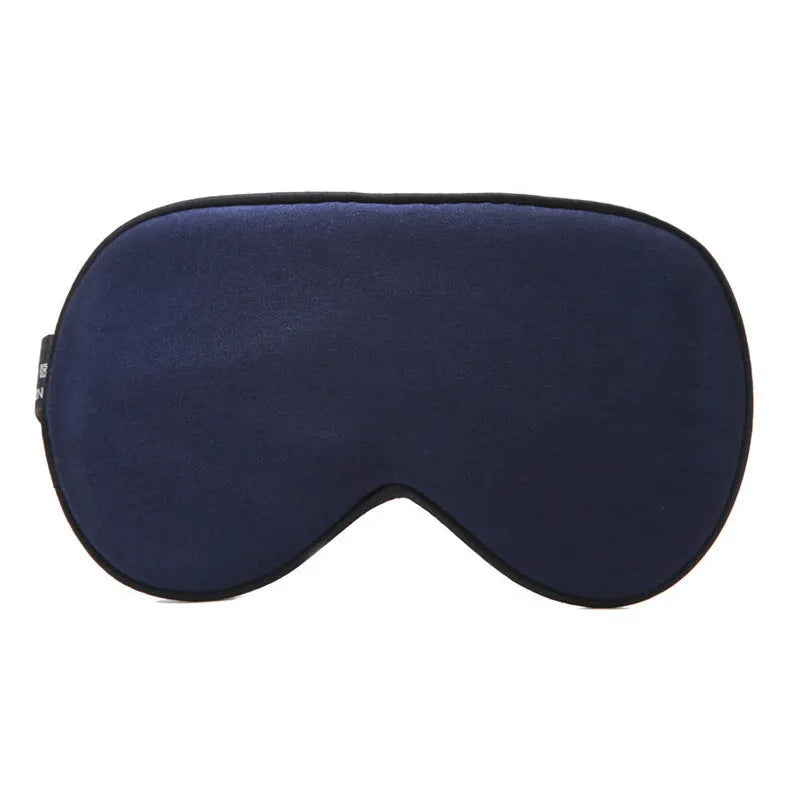 Double-sided Mulberry silk sleep eye mask showing embroidered detail, in a selection of colours on a neutral background.
