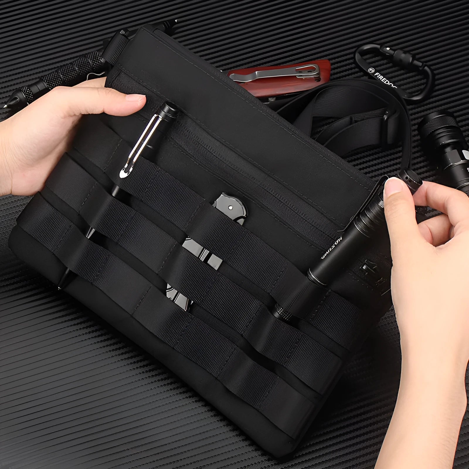 Black multifunctional outdoor kit made of Oxford cloth, measuring 18cm x 3.5cm, designed for military and camping use.