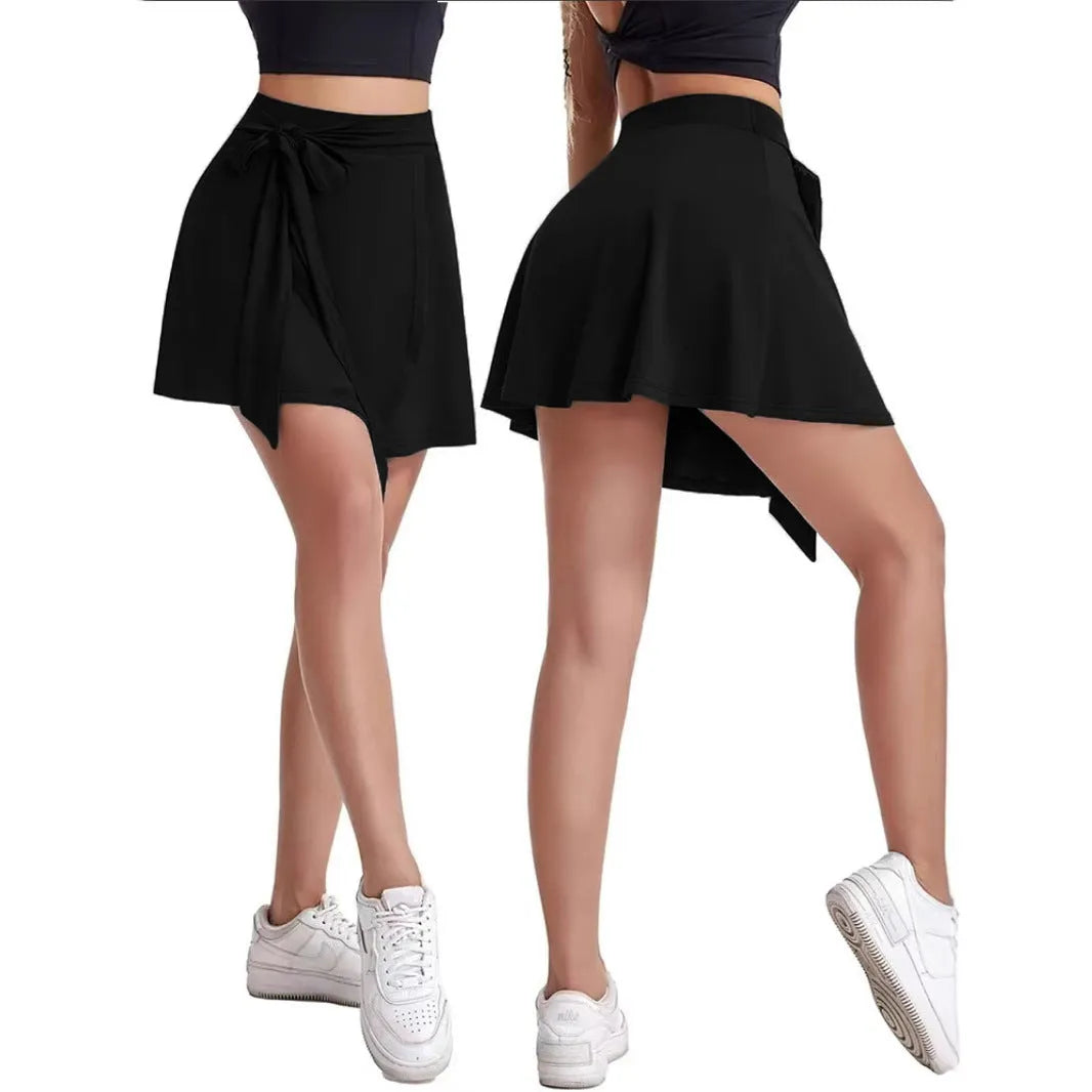 Black thigh-length unisex sports culotte skirt with high waist and integrated shorts layer.