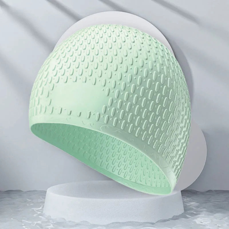 Adult solid colour silicone swimming cap with water drop design shown in multiple colour options.