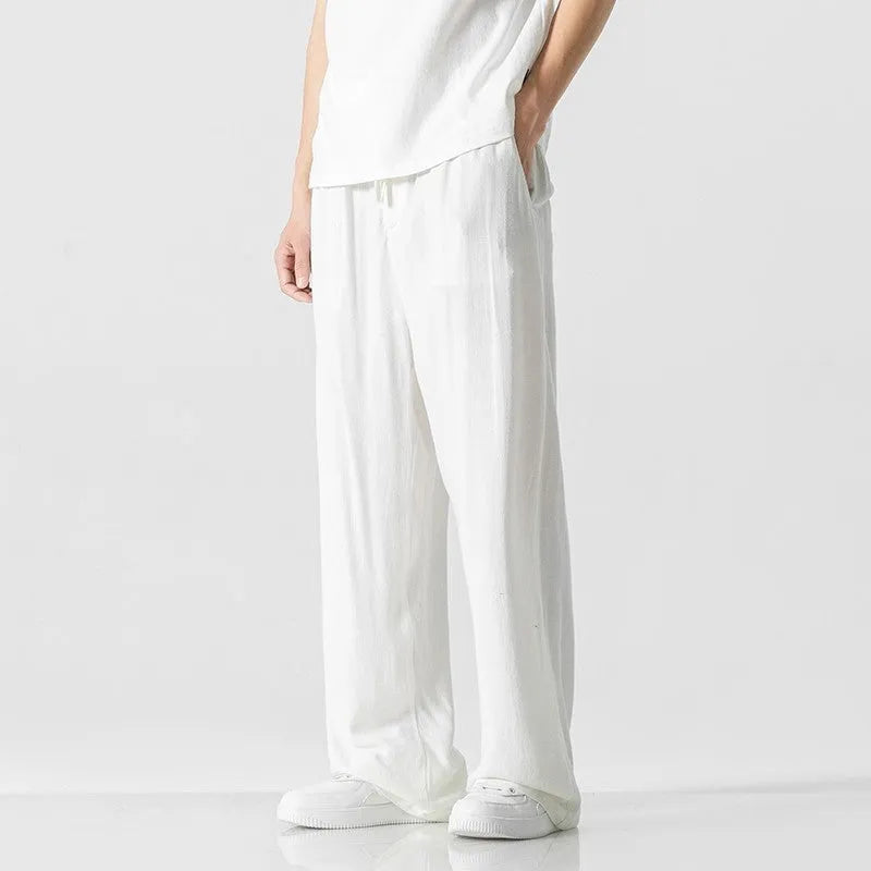 Men's linen trousers in straight-leg cut with cropped length and drawstring waist in beige colour