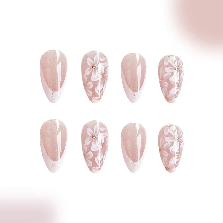 Short almond-shaped glossy French style press-on nails with removable glitter powder flower decorations, colour C625