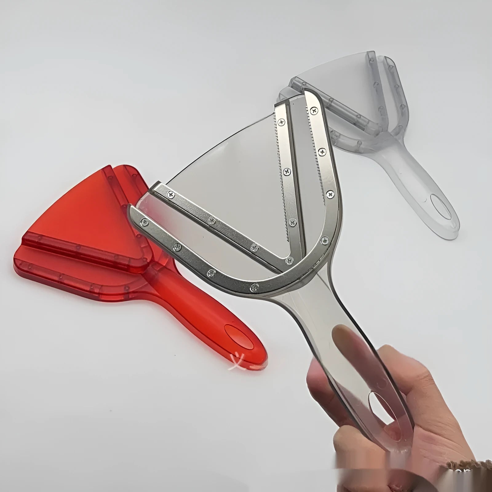 Red telescopic can opener and bottle opener multi-tool with adjustable handle on a white background.
