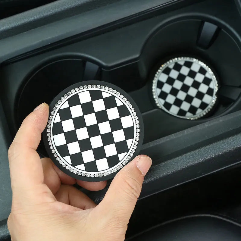 Plastic universal car cup holder mat in a black and white checkerboard pattern