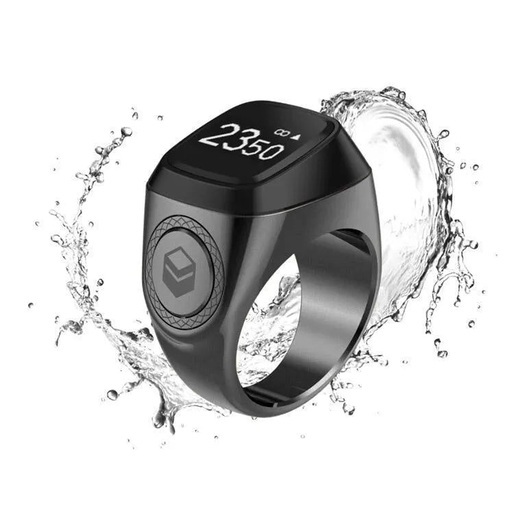 Zikr1 smart ring in black, green, rose gold, or silver on a charging case with USB cable