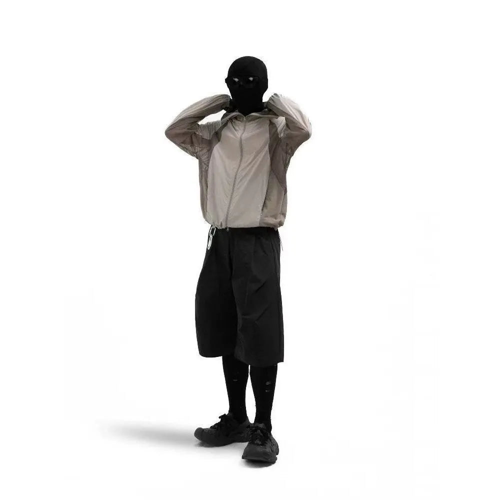 Mesh-stitched sun protective clothing in desert brown, light grey, red or blue.