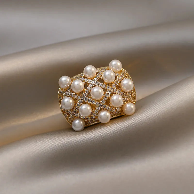 Copper zircon pearl geometric ring with 14K gold electroplated finish and adjustable opening for women.