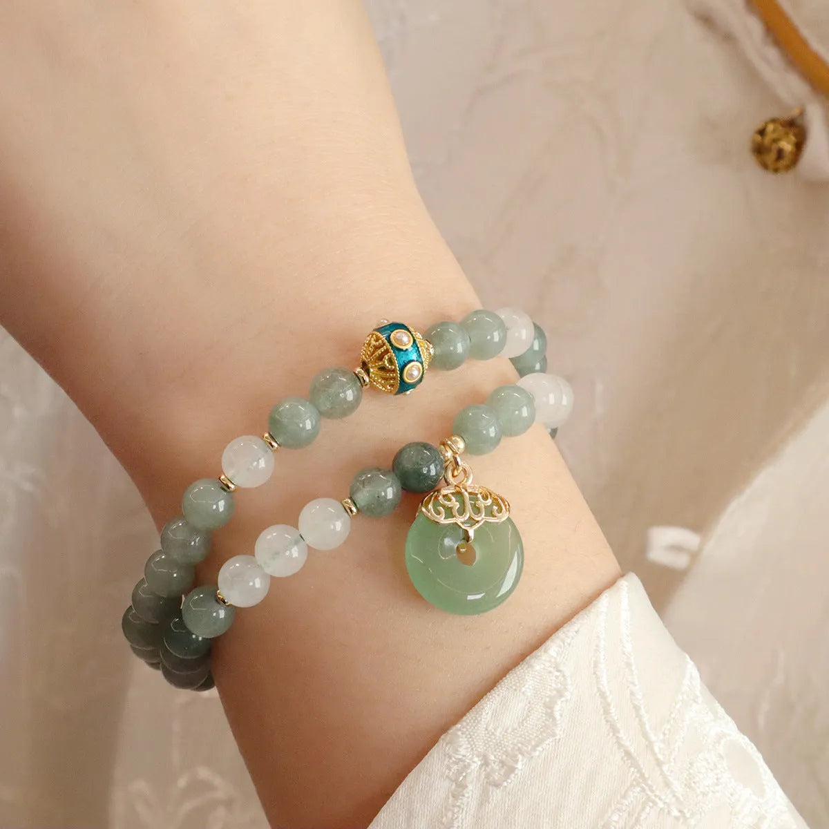 Women's jade safety buckle bracelet with geometric beads and traditional peace buckle clasp.