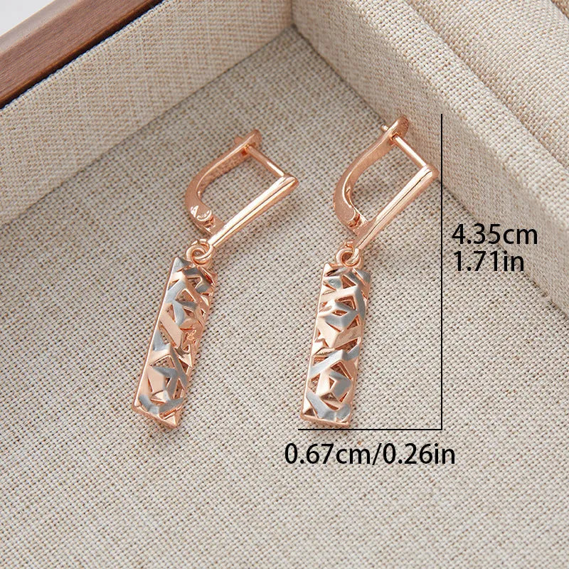 A pair of rectangular hollow stud earrings with a two-tone electroplated finish on a white background.