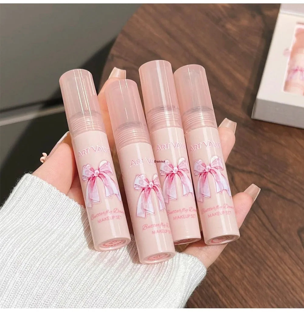 Butterfly Box pink makeup set with four matte lip muds, powder blusher and matching necklace