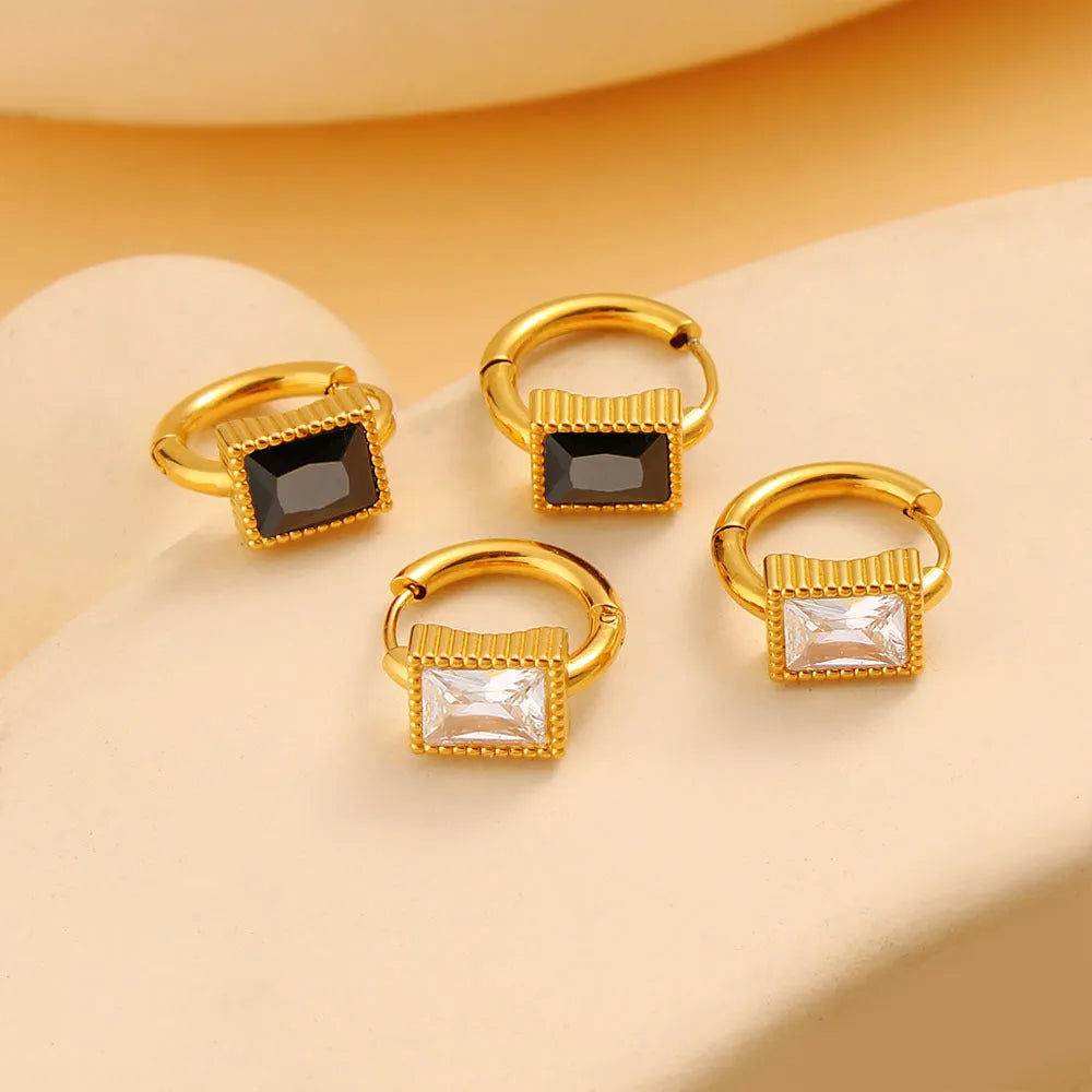Square geometric zircon earrings with round ring details on stainless steel.