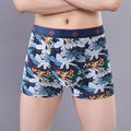Men's cotton boxer shorts in a floral print, showing the mid-waist fit and U-shaped design.