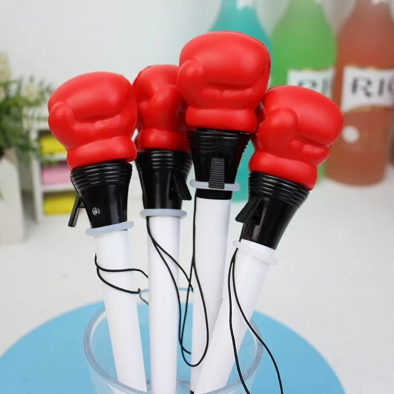 Four pressure relief pens with boxing ejection mechanisms and black ink refills