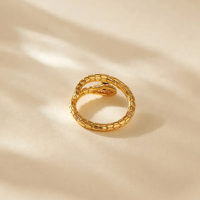 Snake-shaped adjustable index finger ring with copper construction and 18K gold colour finish
