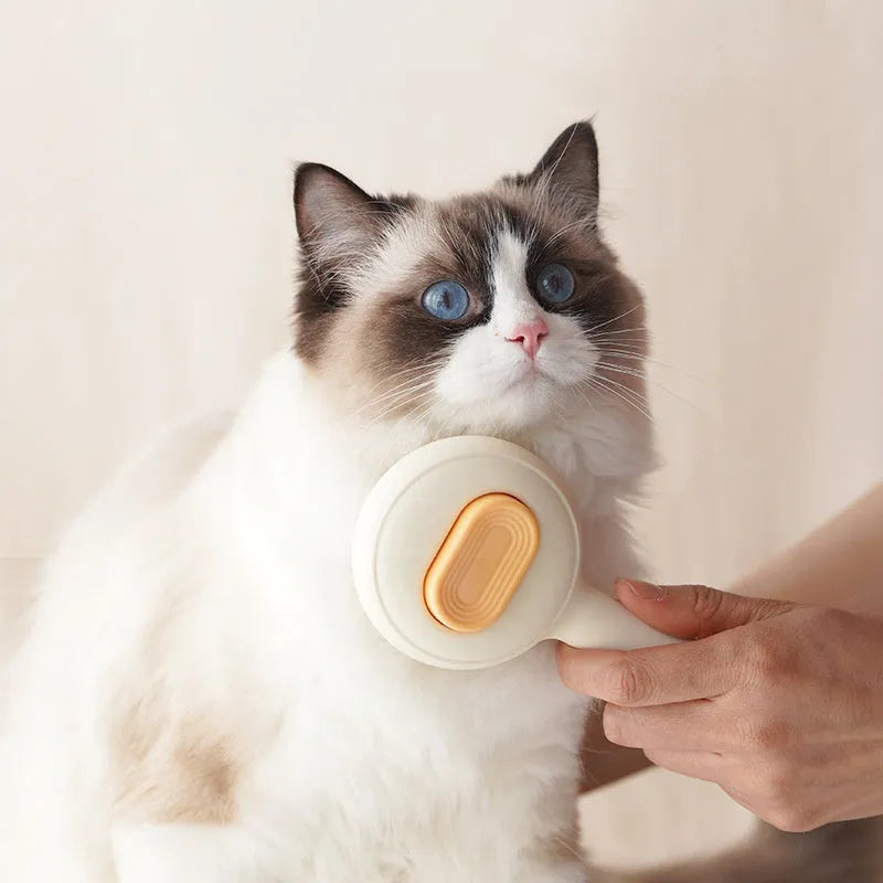 Stainless steel cat grooming brush with non-slip plastic handle in green or yellow colour