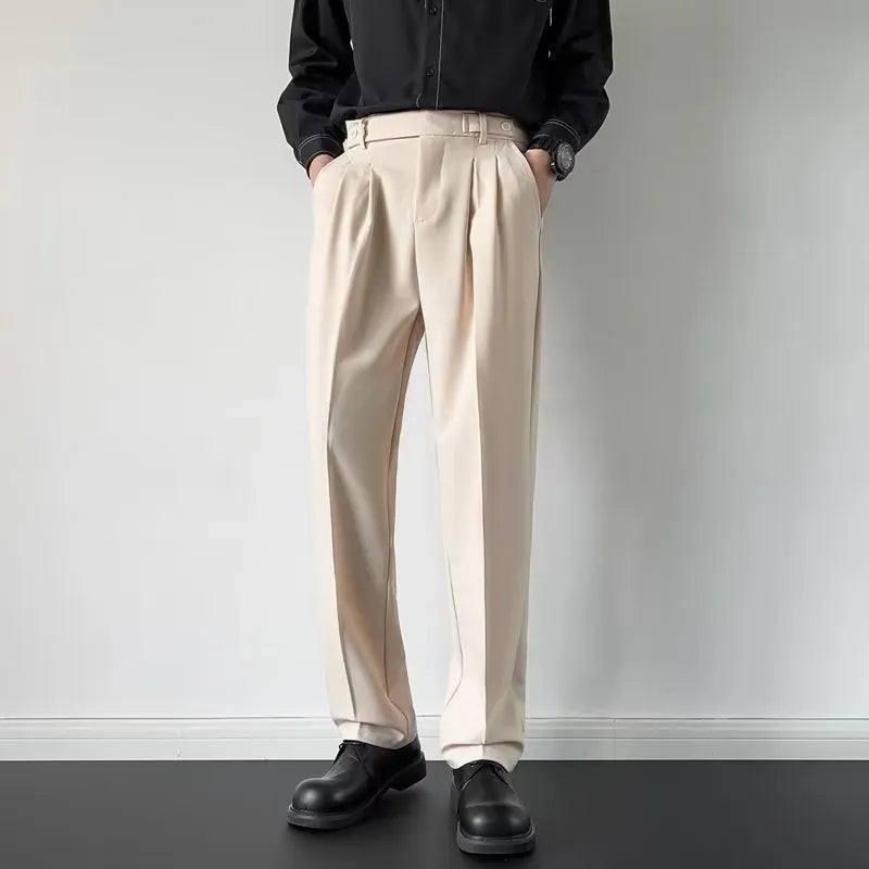 Apricot and black men's straight loose-fit suit trousers on a hanger.