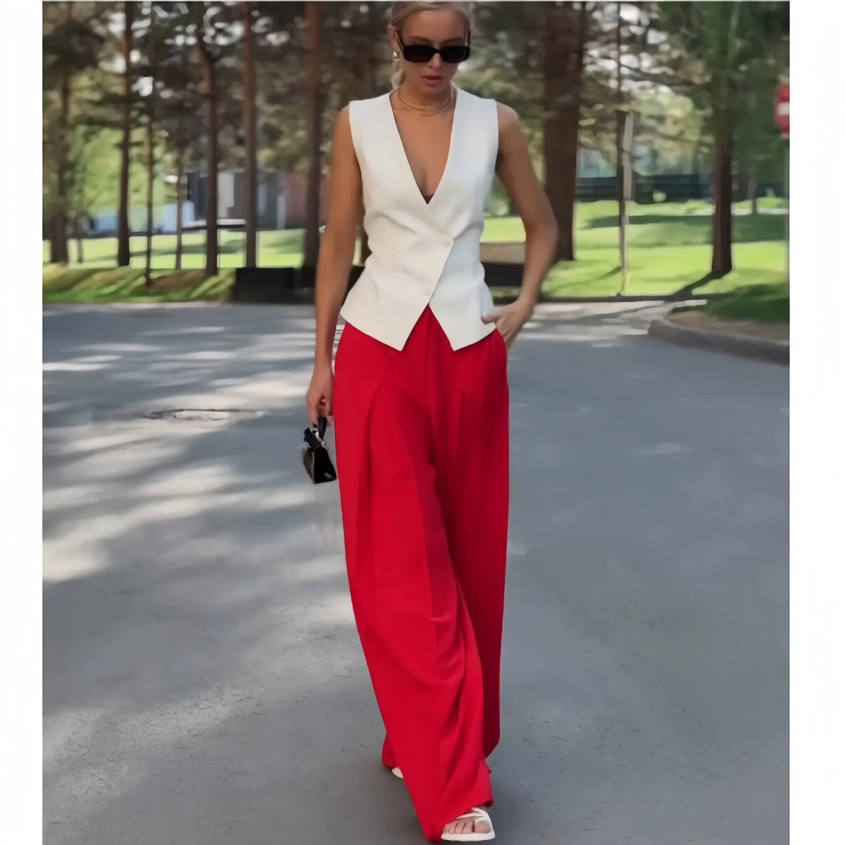 Women's beige polyester two-piece set with sleeveless deep V-neck top and wide-leg trousers