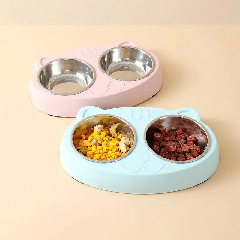 Blue Macaron double bowl plastic pet feeder for cats and dogs on a floor.