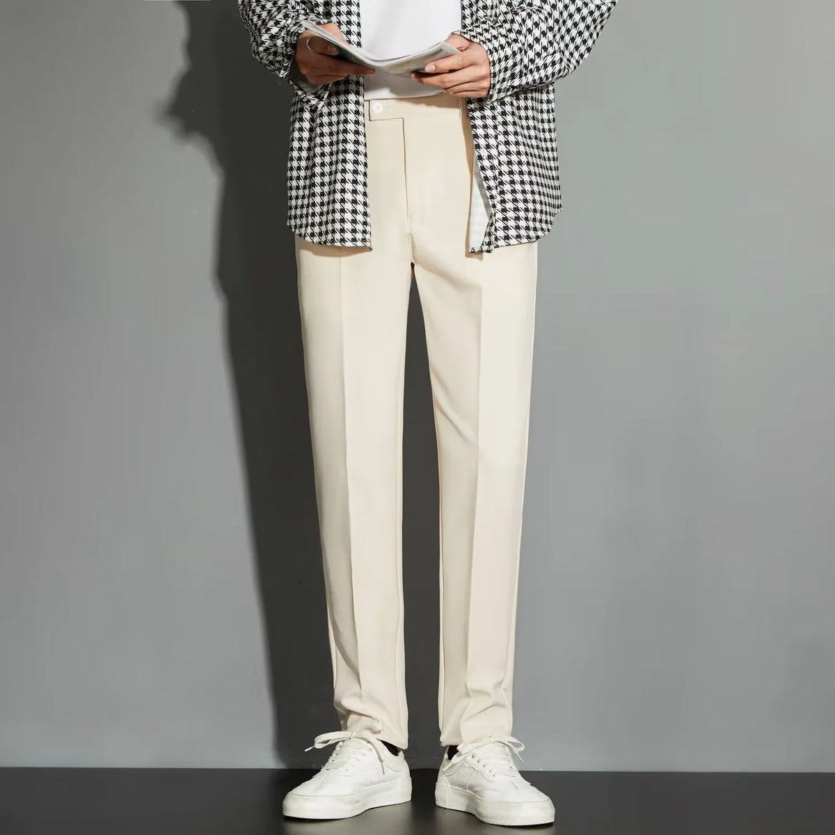 Men's straight leg suit trousers in chemical fibre blend fabric showing spring draping effect