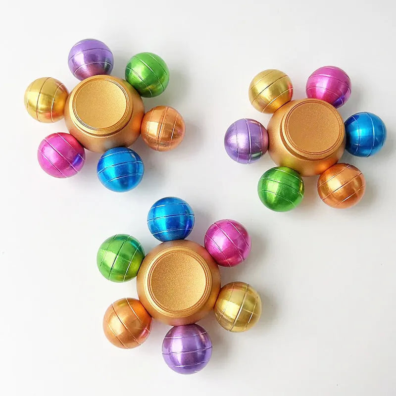 Colourful six Dragon Ball six-bead fingertip gyro in zinc alloy with metal bearing, approximately 6 x 2.2 cm