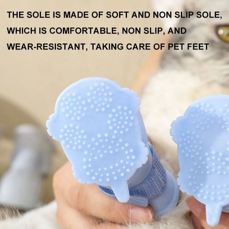 Set of four silicone dog rain boots in Dark Blue, Gray, Light Blue, and Pink, sizes S M L
