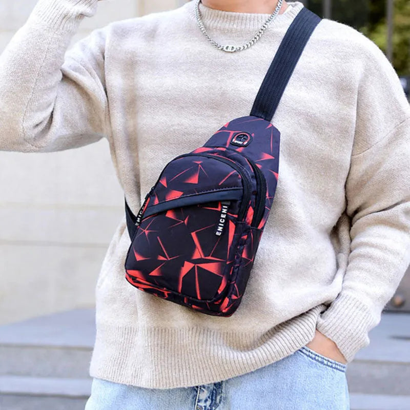 Men's medium blue Oxford cloth crossbody bag showing earphone hole and zipper opening.