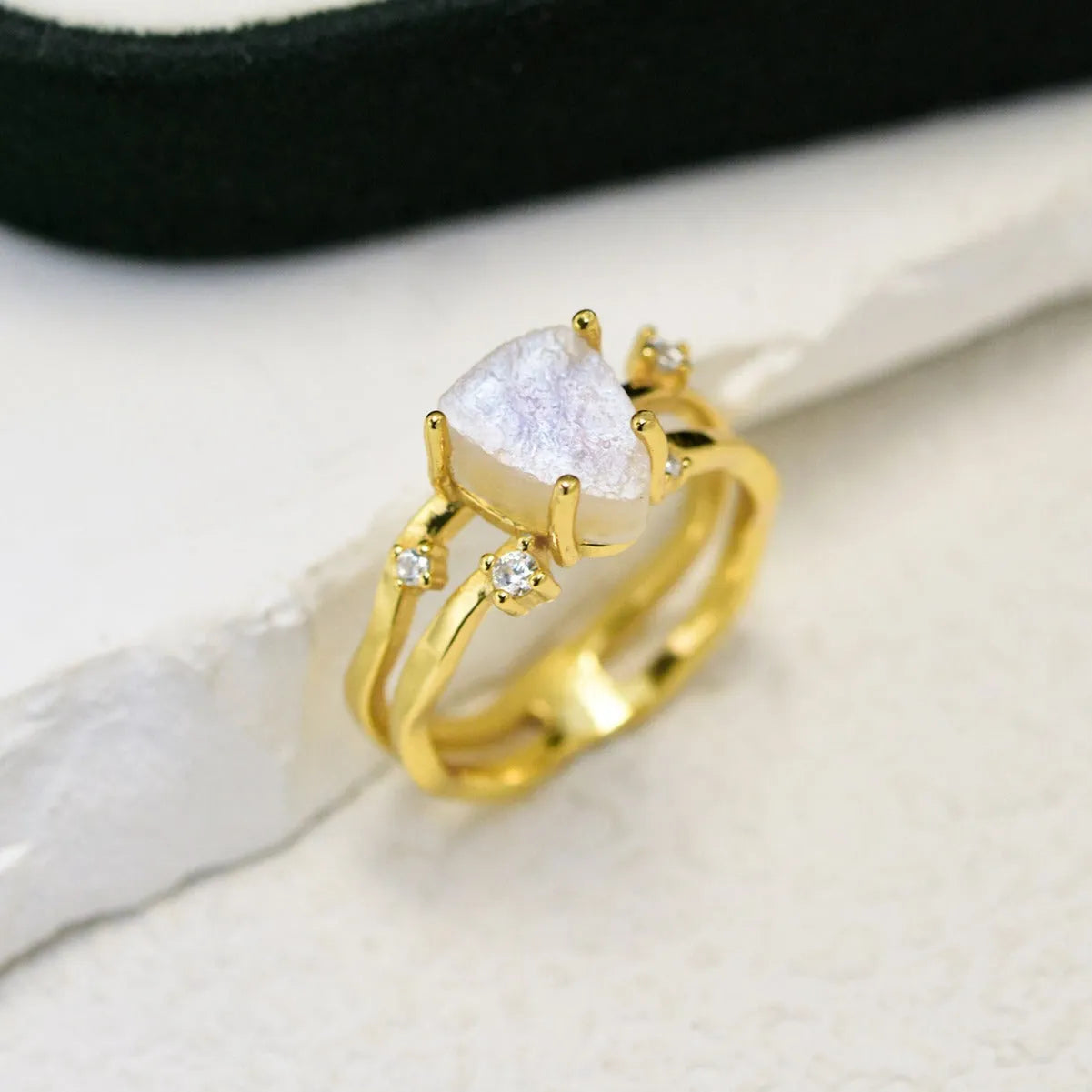 S925 sterling silver geometric ring with irregular triangle shape and moonstone detail in gold tone finish