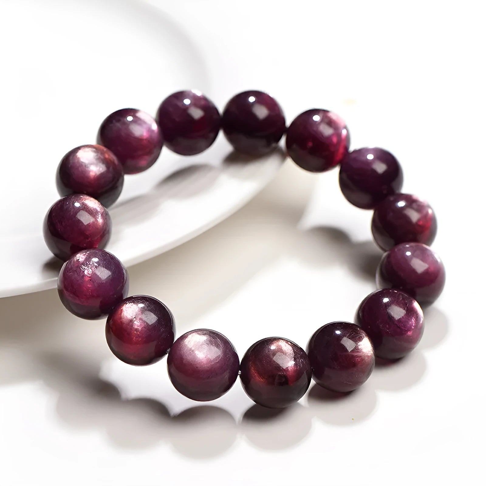Natural purple lepidolite crystal bracelet with polished round beads in geometric design showing size options