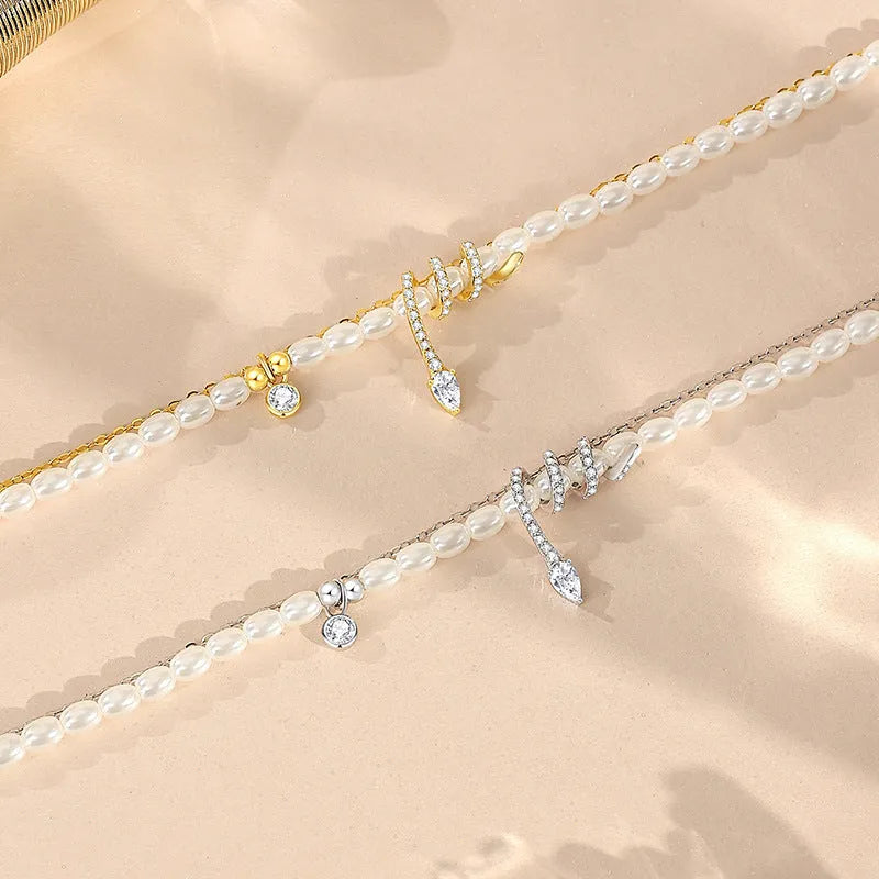 Pearl snake beaded bracelet in 925 sterling silver with electroplated gold finish and geometric animal design