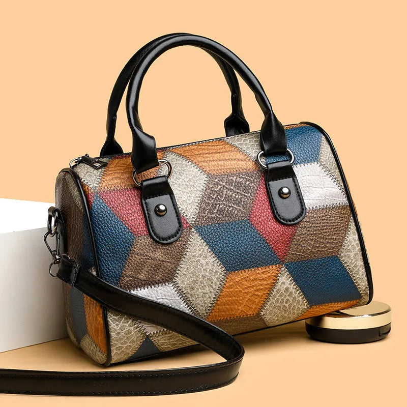 Cylinder crossbody shoulder bag in black or brown PU with plaid geometric pattern and single strap