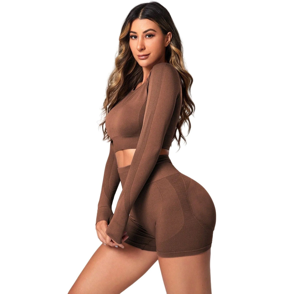 Women's black high-waisted yoga suit with long sleeves and matching trousers