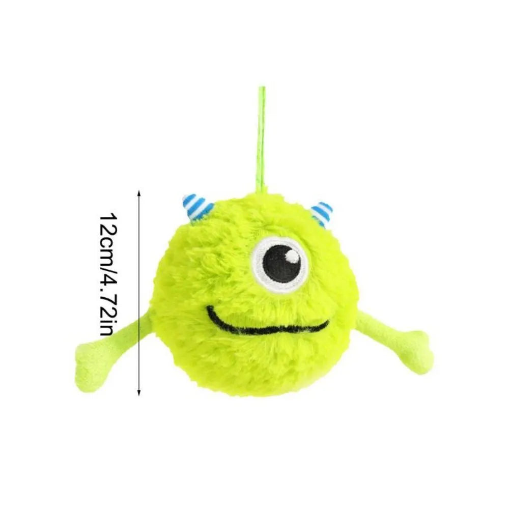 Green sound-activated dog teething toy ball with soft plush exterior for puppy gum massage