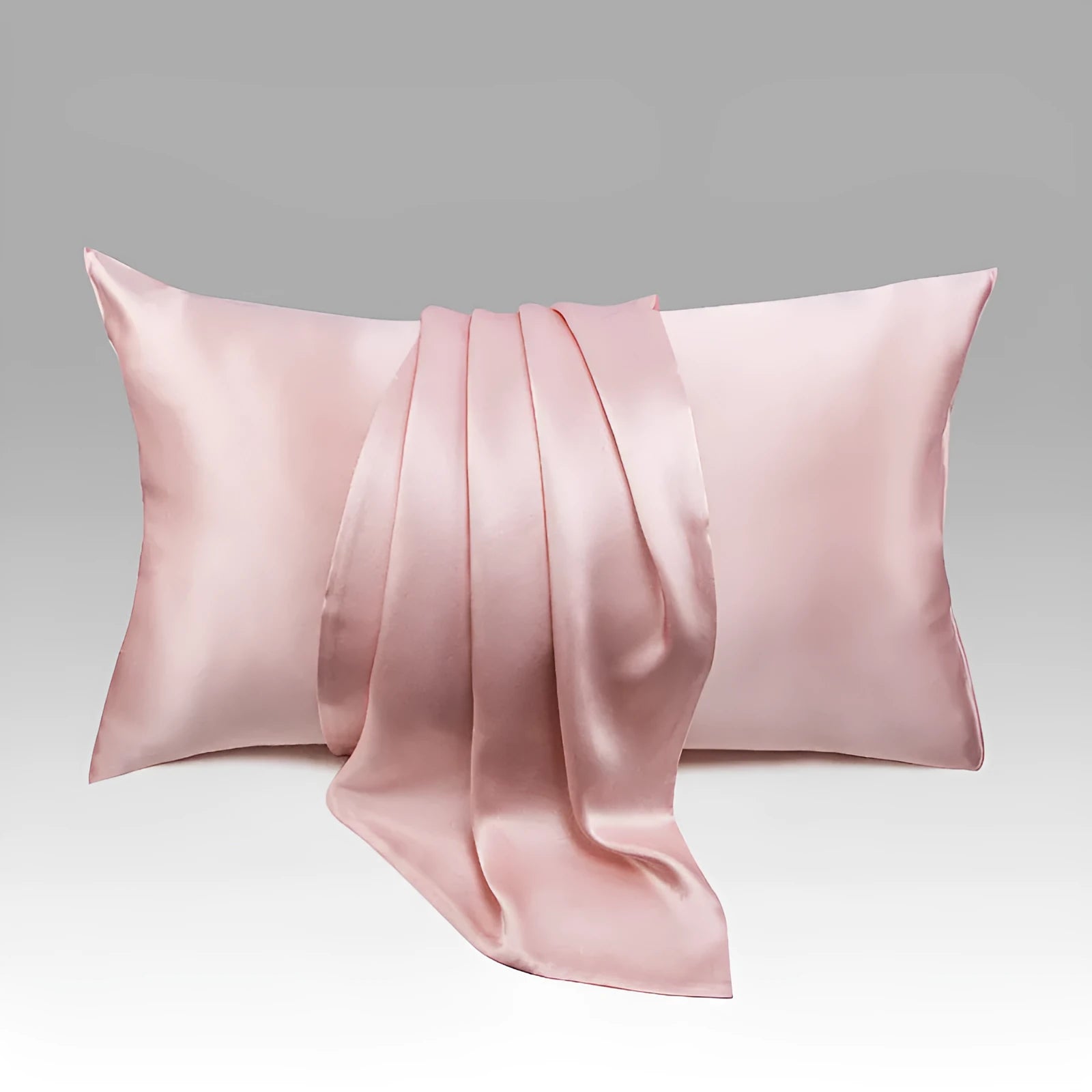 Dark grey 19 momme mulberry silk pillowcase showing envelope closure on a bed.