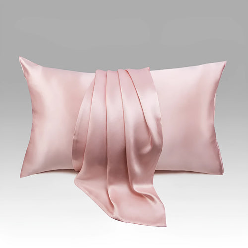 Dark grey 19 momme mulberry silk pillowcase showing envelope closure on a bed.