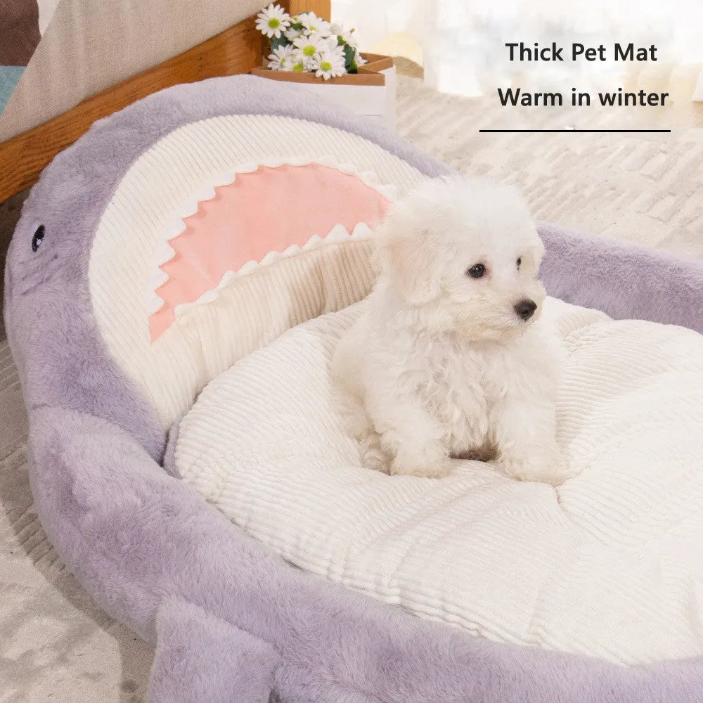 Blue shark pattern pet bed for dogs and cats on a wooden floor, showing plush velvet material.