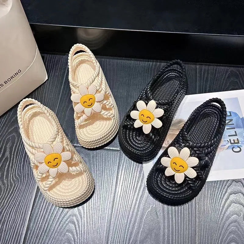 Women's PVC sandals with flower designs and non-slip soles in beige and black colours