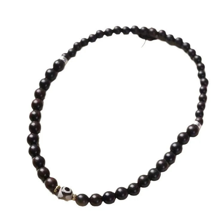 Ebony wood bracelet with 8mm diameter and two circles of beads in retro style