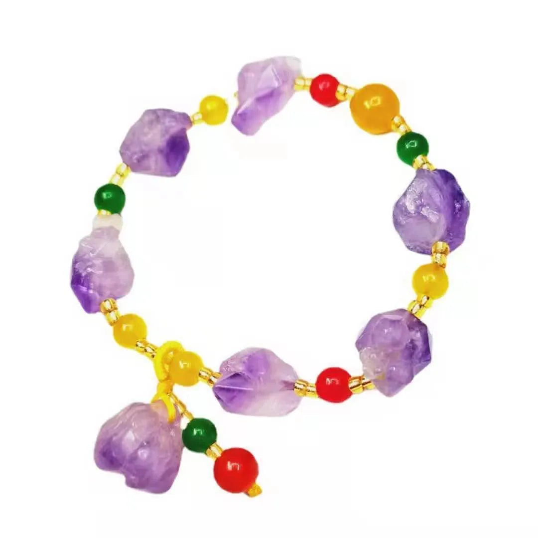 Natural shaped amethyst bead bracelet with a fu character charm on a white background