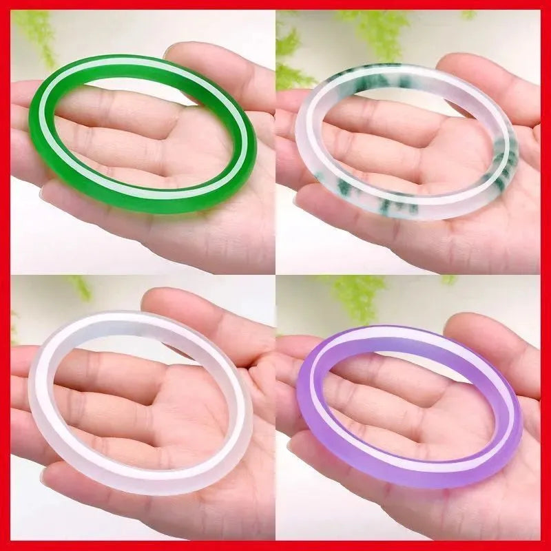 Jade bracelet with floating flower design in ice-like emerald tones and auspicious patterns