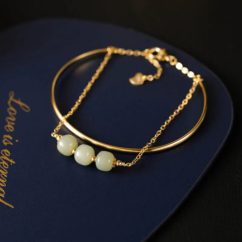 Women's Hetian jade bracelet with gold inlay design available in single, double or three bead versions