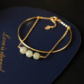 Women's Hetian jade bracelet with gold inlay design available in single, double or three bead versions
