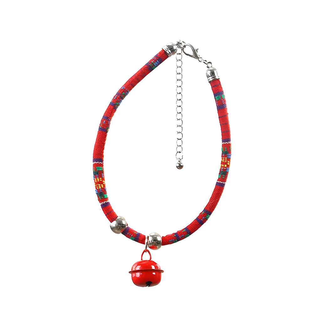 Coloured adjustable nylon pet collar with a metal buckle and brass bell in black, blue, pink, red, and white options.