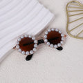 Round pearl-rimmed sunglasses for a dog or cat costume, shown in multiple colours.