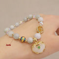 Geometric women's bracelet with grey jade and strawberry quartz stones and metal accents